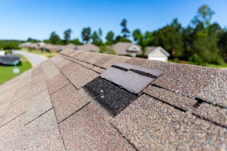 a missing shingle after storm damage on a roof in White Bear Lake