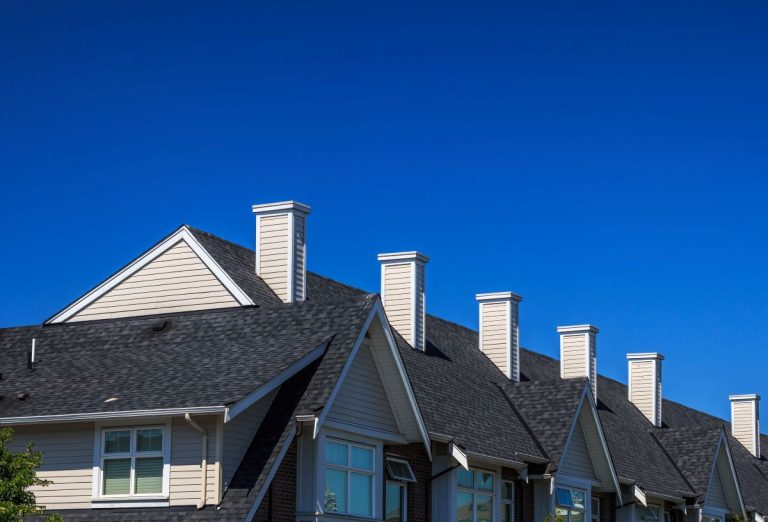 apartment building with dark grey asphalt shingle roof, White Bear Lake